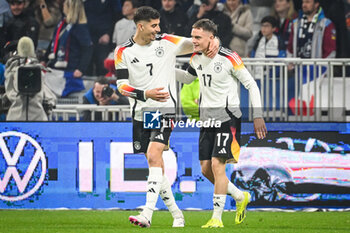 2024-03-23 - Florian WIRTZ of Germany celebrate his goal with Kai HAVERTZ of Germany during the International Friendly football match between France and Germany on March 23, 2024 at Groupama stadium in Decines-Charpieu near Lyon, France - FOOTBALL - FRIENDLY GAME - FRANCE V GERMANY - FRIENDLY MATCH - SOCCER