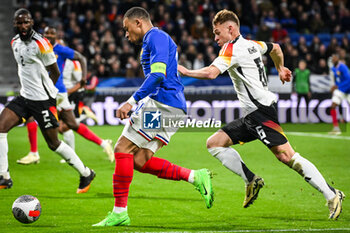 2024-03-23 - Kylian MBAPPE of France and Joshua KIMMICH of Germany during the International Friendly football match between France and Germany on March 23, 2024 at Groupama stadium in Decines-Charpieu near Lyon, France - FOOTBALL - FRIENDLY GAME - FRANCE V GERMANY - FRIENDLY MATCH - SOCCER
