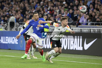 2024-03-23 - Joshua Kimmich of Germany, left Kylian Mbappe of France during the International Friendly football match between France and Germany on March 23, 2024 at Groupama stadium in Decines-Charpieu near Lyon, France - FOOTBALL - FRIENDLY GAME - FRANCE V GERMANY - FRIENDLY MATCH - SOCCER
