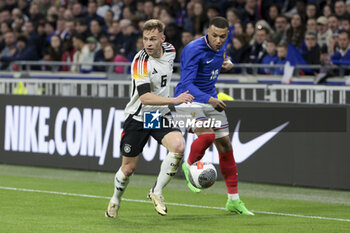 2024-03-23 - Joshua Kimmich of Germany, Kylian Mbappe of France during the International Friendly football match between France and Germany on March 23, 2024 at Groupama stadium in Decines-Charpieu near Lyon, France - FOOTBALL - FRIENDLY GAME - FRANCE V GERMANY - FRIENDLY MATCH - SOCCER