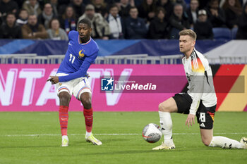 2024-03-23 - Ousmane Dembele of France, Maximilian Mittelstadt of Germany during the International Friendly football match between France and Germany on March 23, 2024 at Groupama stadium in Decines-Charpieu near Lyon, France - FOOTBALL - FRIENDLY GAME - FRANCE V GERMANY - FRIENDLY MATCH - SOCCER