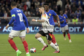 2024-03-23 - Robert Andrich of Germany, Aurelien Tchouameni of France during the International Friendly football match between France and Germany on March 23, 2024 at Groupama stadium in Decines-Charpieu near Lyon, France - FOOTBALL - FRIENDLY GAME - FRANCE V GERMANY - FRIENDLY MATCH - SOCCER