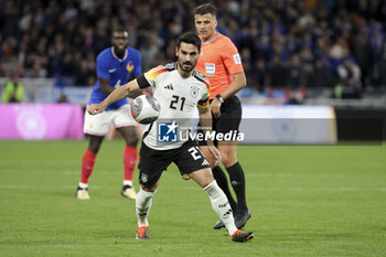 2024-03-23 - Ilkay Gundogan of Germany, Referee Jesus Gil Manzano of Spain during the International Friendly football match between France and Germany on March 23, 2024 at Groupama stadium in Decines-Charpieu near Lyon, France - FOOTBALL - FRIENDLY GAME - FRANCE V GERMANY - FRIENDLY MATCH - SOCCER