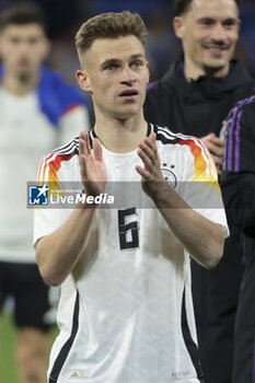 2024-03-23 - Joshua Kimmich of Germany salutes the supporters following the International Friendly football match between France and Germany on March 23, 2024 at Groupama stadium in Decines-Charpieu near Lyon, France - FOOTBALL - FRIENDLY GAME - FRANCE V GERMANY - FRIENDLY MATCH - SOCCER