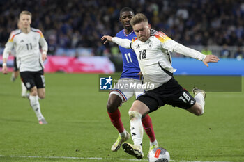 2024-03-23 - Maximilian Mittelstadt of Germany, Ousmane Dembele of France during the International Friendly football match between France and Germany on March 23, 2024 at Groupama stadium in Decines-Charpieu near Lyon, France - FOOTBALL - FRIENDLY GAME - FRANCE V GERMANY - FRIENDLY MATCH - SOCCER