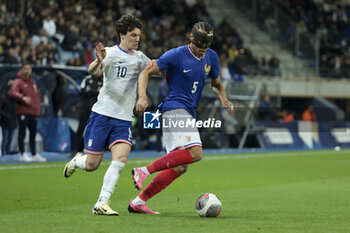 2024-03-25 - Kiliann Sildillia of France, left Paxten Aaronson of USA during the International Under 23 Friendly football match between France U23 and United States, USA U23 on March 25, 2024 at Stade Auguste Bonal in Sochaux Montbeliard, France - FOOTBALL - U23 FRIENDLY GAME - FRANCE V USA - FRIENDLY MATCH - SOCCER