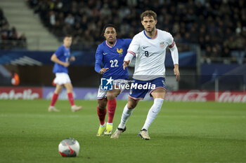 2024-03-25 - Tanner Tessmand of USA, left Wilson Odobert of France during the International Under 23 Friendly football match between France U23 and United States, USA U23 on March 25, 2024 at Stade Auguste Bonal in Sochaux Montbeliard, France - FOOTBALL - U23 FRIENDLY GAME - FRANCE V USA - FRIENDLY MATCH - SOCCER