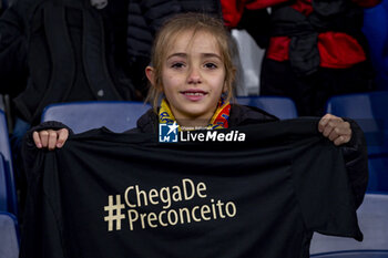 2024-03-26 - A little girl shows a t-shirt against racism during the friendly football match among the national teams of Spain and Brazil at Estadio Santiago Bernabeu, Madrid. - SPAIN VS BRAZIL - FRIENDLY MATCH - SOCCER