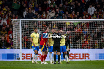 2024-03-26 - Brazilian players Danilo Da Silva, Lucas Paqueta and Bruno Guimaraes seen protesting with the referee during the friendly football match among the national teams of Spain and Brazil at Estadio Santiago Bernabeu, Madrid. - SPAIN VS BRAZIL - FRIENDLY MATCH - SOCCER