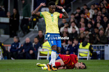 2024-03-26 - Vinicius Junior of Brazil (L) against Robin Le Normand of Spain (R) during the friendly football match among the national teams of Spain and Brazil at Estadio Santiago Bernabeu, Madrid. - SPAIN VS BRAZIL - FRIENDLY MATCH - SOCCER