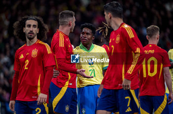 2024-03-26 - Aymeric Laporte of Spain (R) argues with Endrick De Sousa of Brazil (L) during the friendly football match among the national teams of Spain and Brazil at Estadio Santiago Bernabeu, Madrid. - SPAIN VS BRAZIL - FRIENDLY MATCH - SOCCER