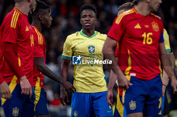 2024-03-26 - Vinicius Junior of Brazil (C) argues with Aymeric Laporte of Spain (R) during the friendly football match among the national teams of Spain and Brazil at Estadio Santiago Bernabeu, Madrid. - SPAIN VS BRAZIL - FRIENDLY MATCH - SOCCER