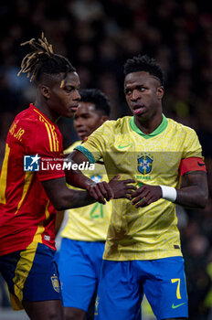 2024-03-26 - Vinicius Junior of Brazil (R) argues with Nico Williams of Spain (L) during the friendly football match among the national teams of Spain and Brazil at Estadio Santiago Bernabeu, Madrid. - SPAIN VS BRAZIL - FRIENDLY MATCH - SOCCER