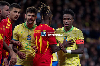 2024-03-26 - Vinicius Junior of Brazil (R) argues with Nico Williams of Spain (L) during the friendly football match among the national teams of Spain and Brazil at Estadio Santiago Bernabeu, Madrid. - SPAIN VS BRAZIL - FRIENDLY MATCH - SOCCER