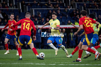2024-03-26 - Lucas Paqueta of Brazil (C) in action with the ball during the friendly football match among the national teams of Spain and Brazil at Estadio Santiago Bernabeu, Madrid. - SPAIN VS BRAZIL - FRIENDLY MATCH - SOCCER