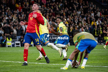 2024-03-26 - Lucas Paqueta of Brazil (L) celebrates his goal with Endrick De Sousa of Brazil (R) during the friendly football match among the national teams of Spain and Brazil at Estadio Santiago Bernabeu, Madrid. - SPAIN VS BRAZIL - FRIENDLY MATCH - SOCCER