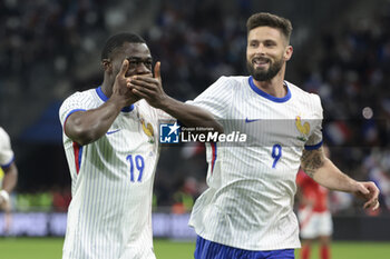 2024-03-26 - Youssouf Fofana of France celebrates his goal with Olivier Giroud of France during the International Friendly football match between France and Chile on March 26, 2024 at Stade Velodrome in Marseille, France - FOOTBALL - FRIENDLY GAME - FRANCE V CHILE - FRIENDLY MATCH - SOCCER