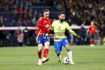 2024-03-26 - Fabian Ruiz of Spain in action against Douglas Luiz of Brazil during the International friendly football match between Spain and Brazil on March 26, 2024 at Santiago Bernabeu stadium in Madrid, Spain - FOOTBALL - FRIENDLY GAME - SPAIN V BRAZIL - FRIENDLY MATCH - SOCCER