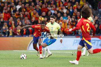 2024-03-26 - Nico Williams of Spain and Lucas Paqueta of Brazil during the International friendly football match between Spain and Brazil on March 26, 2024 at Santiago Bernabeu stadium in Madrid, Spain - FOOTBALL - FRIENDLY GAME - SPAIN V BRAZIL - FRIENDLY MATCH - SOCCER