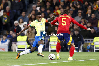 2024-03-26 - Vinicius Junior of Brazil in action against Robin Le Normand of Spain during the International friendly football match between Spain and Brazil on March 26, 2024 at Santiago Bernabeu stadium in Madrid, Spain - FOOTBALL - FRIENDLY GAME - SPAIN V BRAZIL - FRIENDLY MATCH - SOCCER