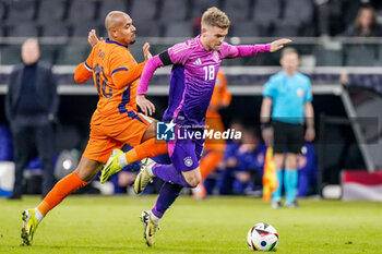 2024-03-26 - Donyell Malen of Netherlands and Maximilian Mittelstädt of Germany during the International Friendly football match between Germany and Netherlands on March 26, 2024 at Deutsche Bank Park in Frankfurt am Main, Germany - FOOTBALL - FRIENDLY GAME - GERMANY V NETHERLANDS - FRIENDLY MATCH - SOCCER