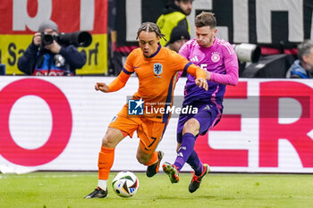 2024-03-26 - Xavi Simons of Netherlands battles for the ball with Pascal Gross of Germany during the International Friendly football match between Germany and Netherlands on March 26, 2024 at Deutsche Bank Park in Frankfurt am Main, Germany - FOOTBALL - FRIENDLY GAME - GERMANY V NETHERLANDS - FRIENDLY MATCH - SOCCER