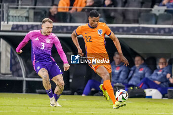 2024-03-26 - Denzel Dumfries of Netherlands is challenged by David Raum of Germany during the International Friendly football match between Germany and Netherlands on March 26, 2024 at Deutsche Bank Park in Frankfurt am Main, Germany - FOOTBALL - FRIENDLY GAME - GERMANY V NETHERLANDS - FRIENDLY MATCH - SOCCER