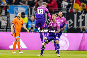 2024-03-26 - Maximilian Mittelstädt of Germany celebrates after scoring his sides first goal with Joshua Kimmich during the International Friendly football match between Germany and Netherlands on March 26, 2024 at Deutsche Bank Park in Frankfurt am Main, Germany - FOOTBALL - FRIENDLY GAME - GERMANY V NETHERLANDS - FRIENDLY MATCH - SOCCER