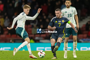2024-03-26 - John McGinn of Scotland and Isaac Price of Northern Ireland during the International Friendly football match between Scotland and Northern Ireland on 26 March 2024 at Hampden Park in Glasgow, Scotland - FOOTBALL - FRIENDLY GAME - SCOTLAND V NORTHERN IRELAND - FRIENDLY MATCH - SOCCER