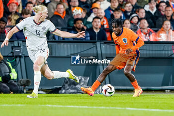 2024-06-10 - Jeremie Frimpong of Netherlands is challenged by Kolbeinn Finnsson of Iceland during the International Friendly football match between Netherlands and Iceland on June 10, 2024 at Stadion Feijenoord de Kuip in Rotterdam, Netherlands - FOOTBALL - FRIENDLY GAME - NETHERLANDS V ICELAND - FRIENDLY MATCH - SOCCER