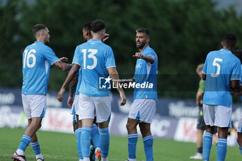 2024-07-16 - Napoli's Italian defender Leonardo Spinazzola celebrates after scoring a goal with team mate during friendly match SSC Napoli Anaune val di Non SSC Napoli's 2024-25 preseason training camp in val di sole in Trentino, Dimaro Folgarida

 - NAPOLI VS ANAUNE VAL DI NON - FRIENDLY MATCH - SOCCER