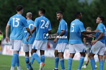 2024-07-16 - Napoli's Italian defender Leonardo Spinazzola celebrates after scoring a goal with team mate during friendly match SSC Napoli Anaune val di Non SSC Napoli's 2024-25 preseason training camp in val di sole in Trentino, Dimaro Folgarida

 - NAPOLI VS ANAUNE VAL DI NON - FRIENDLY MATCH - SOCCER