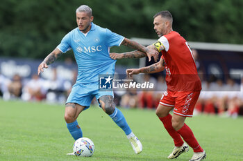 2024-07-20 - Napoli's Italian defender Pasquale Mazzocchi challenges for the ball with Mantova's Italian midfielder Salvatore Burrai during friendly match SSC Napoli vs Mantova in SSC Napoli's 2024-25 preseason training camp in val di sole in Trentino, Dimaro Folgarida

 - NAPOLI VS MANTOVA - FRIENDLY MATCH - SOCCER