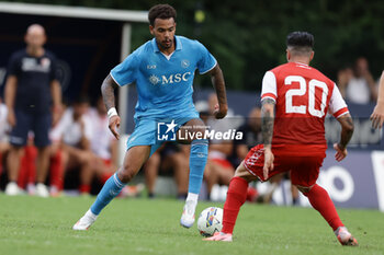 2024-07-20 - Napoli's Belgian forward Cyril Ngonge challenges for the ball with Mantova's Italian midfielder Mattia Muroni during friendly match SSC Napoli vs Mantova in SSC Napoli's 2024-25 preseason training camp in val di sole in Trentino, Dimaro Folgarida

 - NAPOLI VS MANTOVA - FRIENDLY MATCH - SOCCER