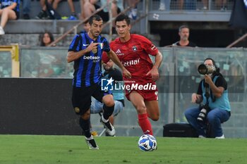 2024-08-02 - Henrikh Mkhitaryan (Inter) thwarted by Pietro Beruatto (Pisa) - PISA SC VS INTER - FC INTERNAZIONALE - FRIENDLY MATCH - SOCCER