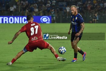 2024-08-02 - Federico Dimarco (Inter) thwarted by Elia Giani (Pisa) - PISA SC VS INTER - FC INTERNAZIONALE - FRIENDLY MATCH - SOCCER