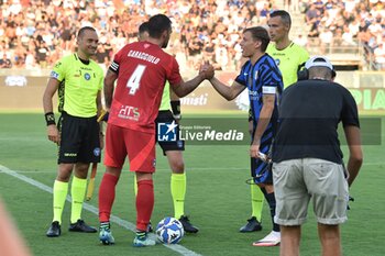 2024-08-02 - Antonio Caracciolo (Pisa) and Nicolo' Barella (Inter) - PISA SC VS INTER - FC INTERNAZIONALE - FRIENDLY MATCH - SOCCER