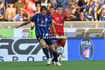 2024-08-02 - Francesco Acerbi (Inter) and Gabriele Piccinini (Pisa) fight for the ball - PISA SC VS INTER - FC INTERNAZIONALE - FRIENDLY MATCH - SOCCER