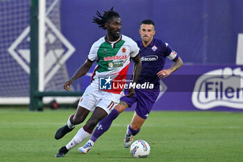 2024-07-19 - ACF Fiorentina's defender Cristiano Biraghi agains AC Reggiana's forward Cedric Gondo - ACF FIORENTINA VS AC REGGIANA - FRIENDLY MATCH - SOCCER