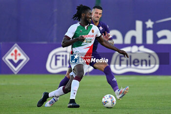 2024-07-19 - ACF Fiorentina's defender Cristiano Biraghi agains AC Reggiana's forward Cedric Gondo - ACF FIORENTINA VS AC REGGIANA - FRIENDLY MATCH - SOCCER