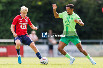 2024-07-24 - Hakon Arnar Haraldsson (OSC Lille) and Tiago Tomas (VfL Wolfsburg) during the Friendly football match between VfL Wolfsburg and LOSC Lille on 24 July 2024 at Jahnstadion in Rheda-Wiedenbrück, Germany - FOOTBALL - FRIENDLY GAME - WOLFSBURG V LILLE - FRIENDLY MATCH - SOCCER