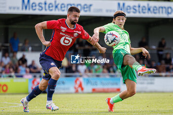 2024-07-24 - Edon Zhegrova (OSC Lille) and Bennit Bröger (VfL Wolfsburg) during the Friendly football match between VfL Wolfsburg and LOSC Lille on 24 July 2024 at Jahnstadion in Rheda-Wiedenbrück, Germany - FOOTBALL - FRIENDLY GAME - WOLFSBURG V LILLE - FRIENDLY MATCH - SOCCER