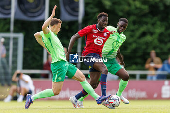 2024-07-24 - Yannick Gerhardt (VfL Wolfsburg), Rafael Fernandes (OSC Lille), Kofi Amoako (VfL Wolfsburg) during the Friendly football match between VfL Wolfsburg and LOSC Lille on 24 July 2024 at Jahnstadion in Rheda-Wiedenbrück, Germany - FOOTBALL - FRIENDLY GAME - WOLFSBURG V LILLE - FRIENDLY MATCH - SOCCER