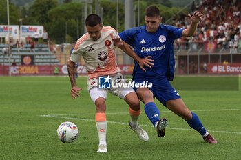 2024-08-03 - Roma's Enzo Le Fee in action against Olympiacos FC Francisco Ortega during the friendly match AS Roma - Olympiacos FC at the 