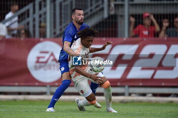 2024-08-03 - Roma's Aboubacar Sangare Traore in action against Olympiacos FC Kristoffer Velde during the friendly match AS Roma - Olympiacos FC at the 