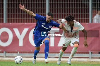 2024-08-03 - Roma's Aboubacar Sangare Traore in action against Olympiacos FC Kristoffer Velde during the friendly match AS Roma - Olympiacos FC at the 