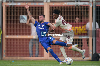 2024-08-03 - Roma's Aboubacar Sangare Traore in action against Olympiacos FC Kristoffer Velde during the friendly match AS Roma - Olympiacos FC at the 