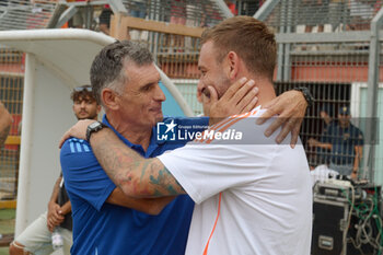 2024-08-03 - Roma's Coach Daniele De Rossi against Olympiacos FC coach Jose Luis Mendilibar during the friendly match AS Roma - Olympiacos FC at the 