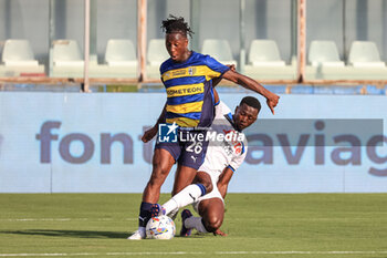 2024-08-04 - Woyo Coulibaly (Parma Calcio) in tackle - PARMA CALCIO VS ATALANTA BC - FRIENDLY MATCH - SOCCER