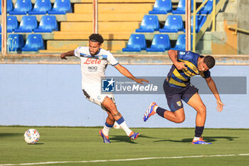 2024-08-04 - Sead Kolasinac (Atalanta BC) and Simon Sohm (Parma Calcio) battle for the ball - PARMA CALCIO VS ATALANTA BC - FRIENDLY MATCH - SOCCER